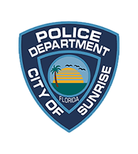 Police Department City of Sunrise, Florida badge featuring a sun, palm tree, and birds—a distinctive emblem often seen at local corporate events and business events.